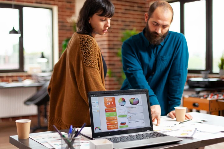 Two employees are discussing