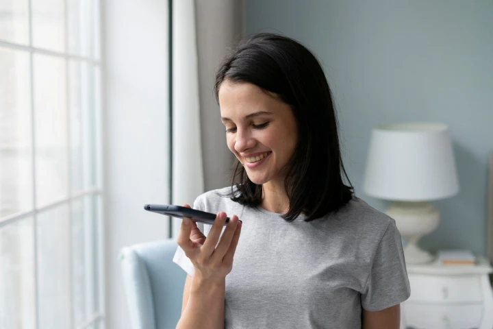 An illustration depicting a lady is using voice search feature