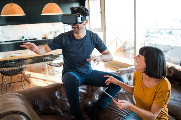 An illustration depicting two people are enjoying the AR and VR technolies